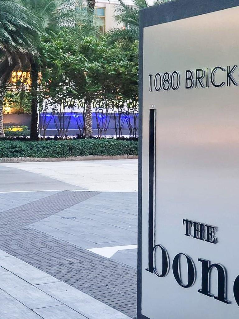 a street sign on a street next to a building