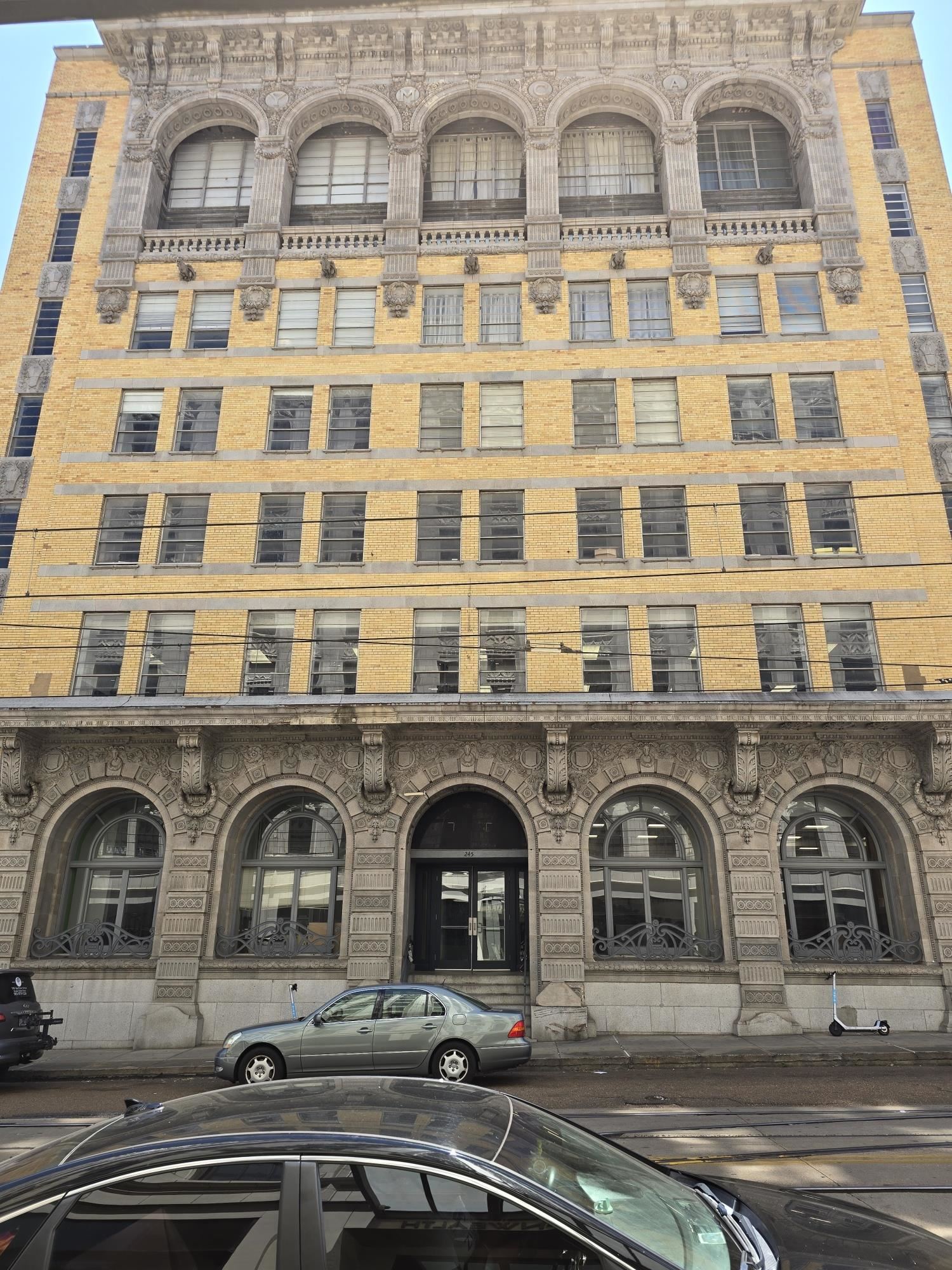 a front view of a building with many windows