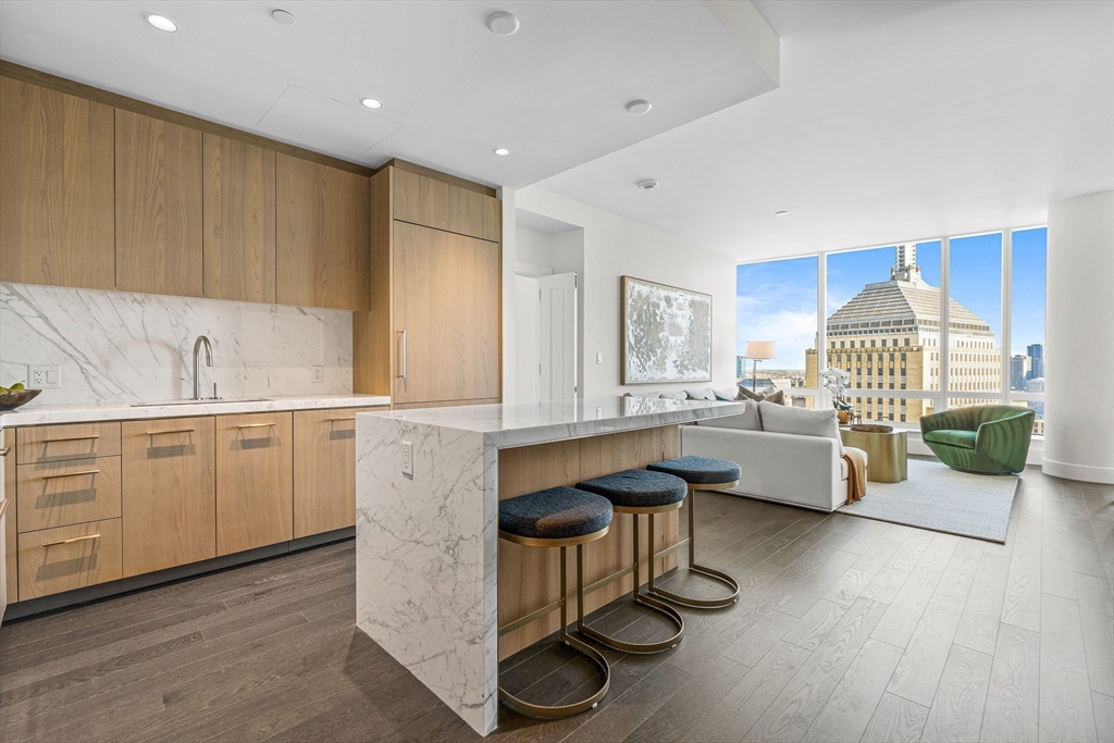 a kitchen with sink cabinets and wooden floor