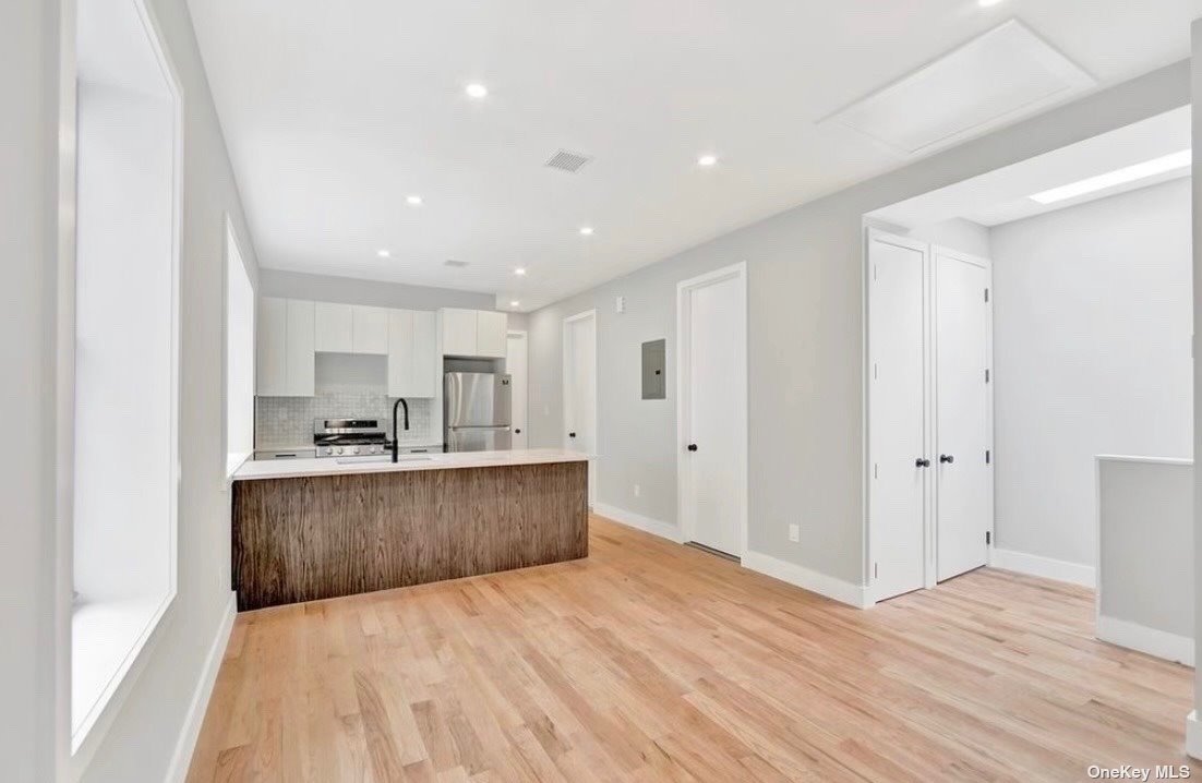 a view of kitchen with wooden floor