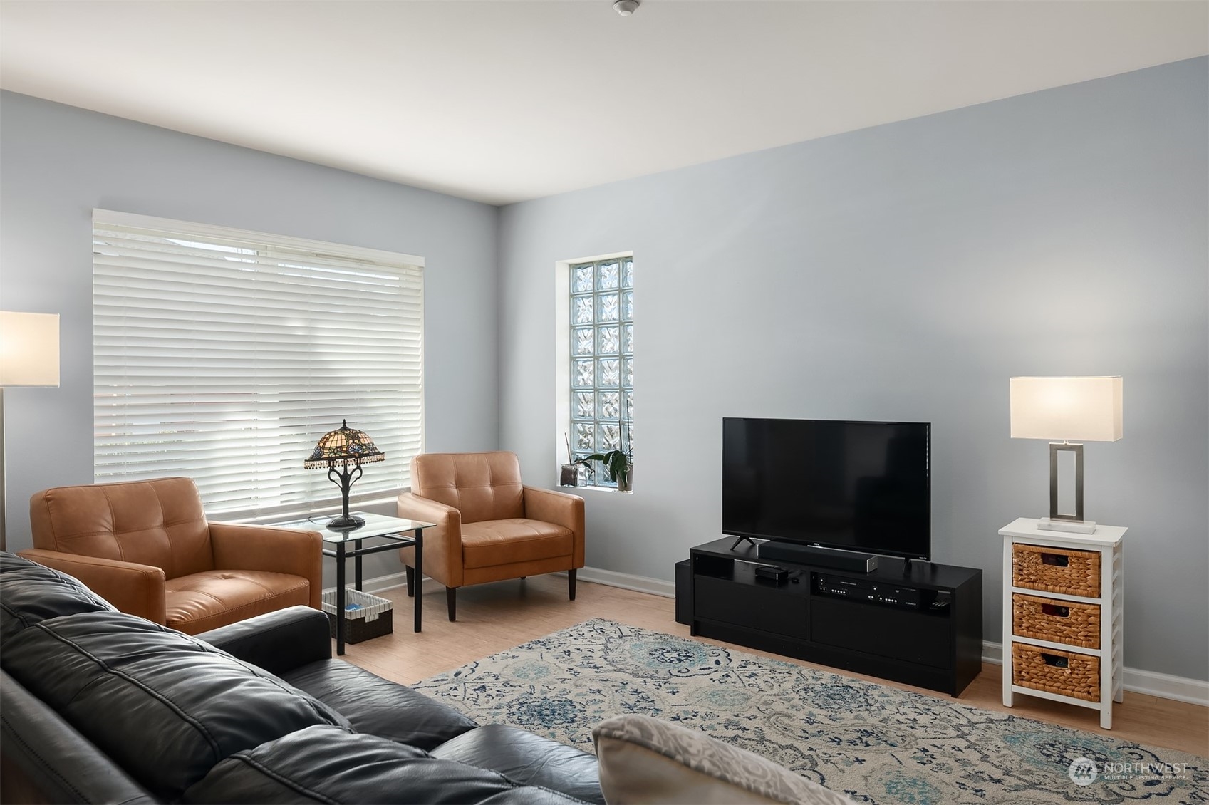 a living room with furniture and a flat screen tv