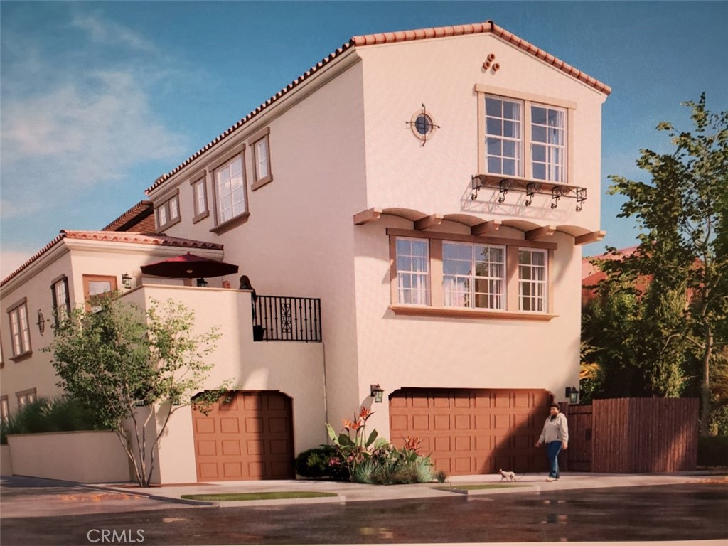 a front view of a house with garage