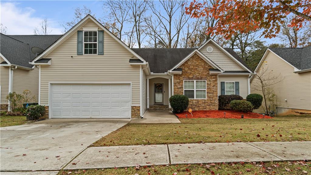 a front view of a house with a yard