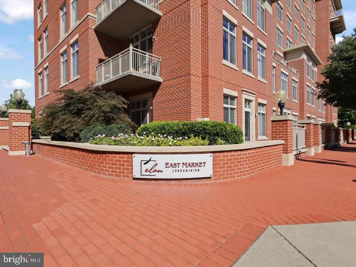 a view of a street with a building in the background