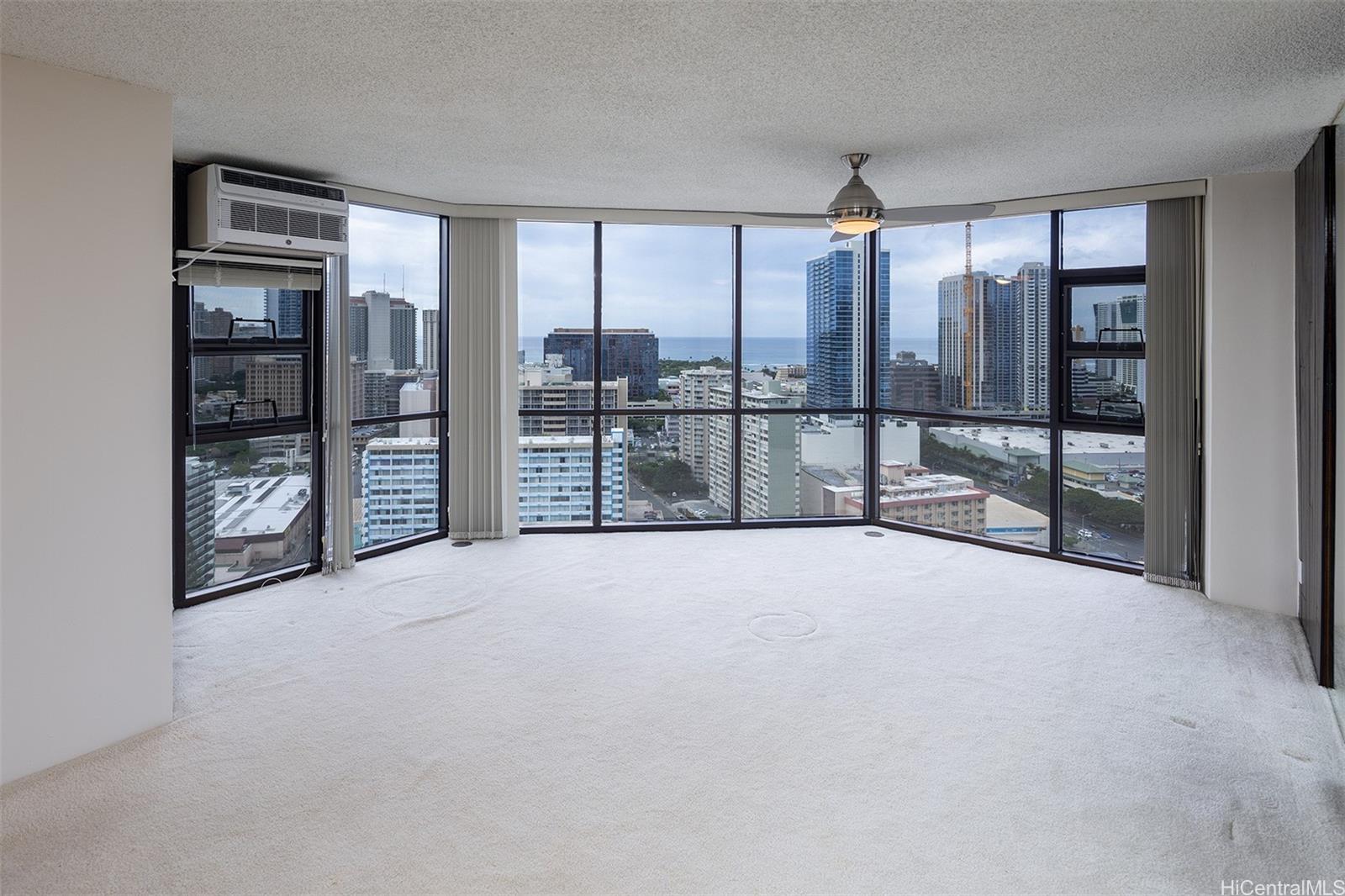 a view of an empty room with windows