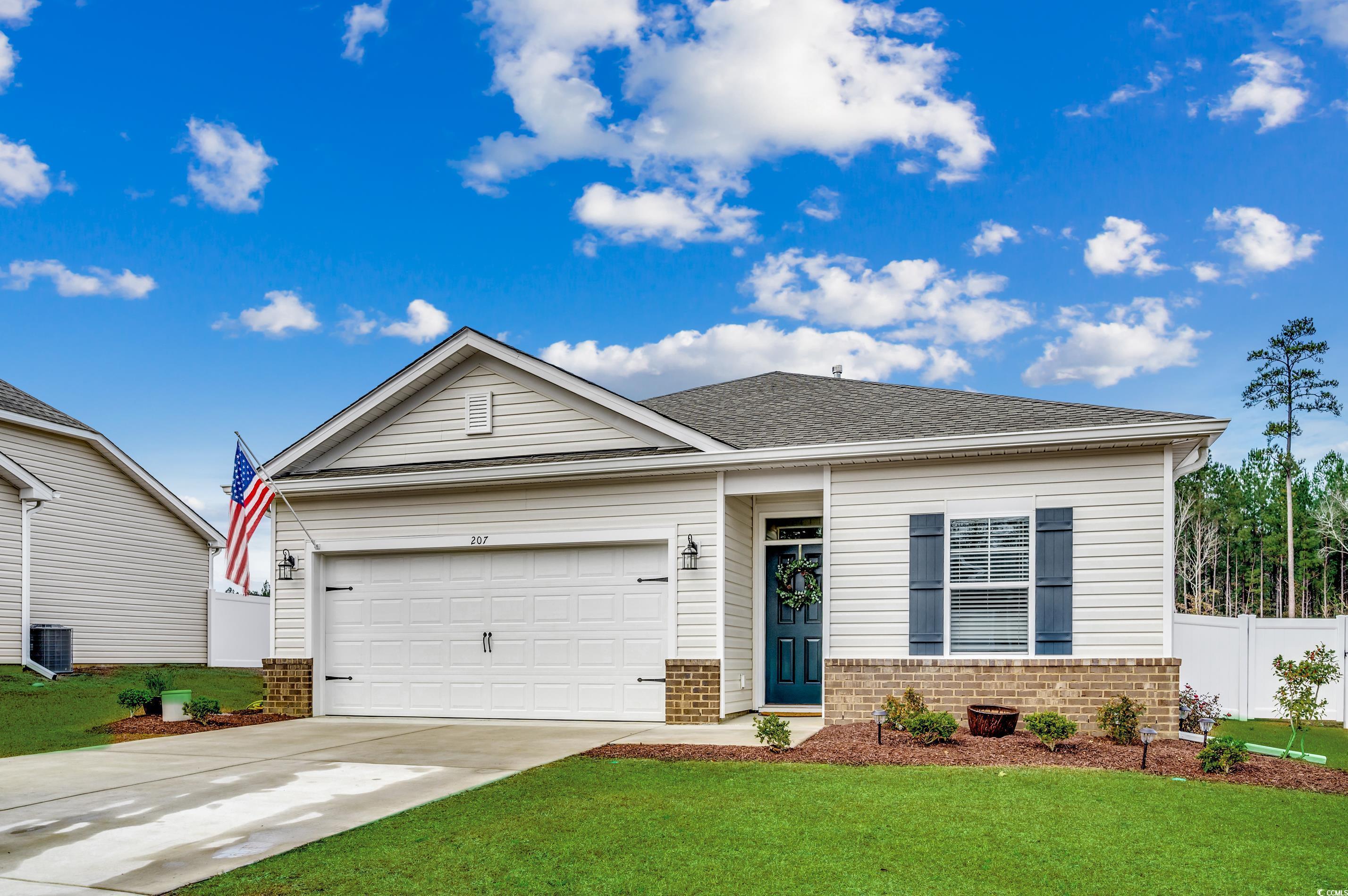 View of front of house featuring a garage, a front