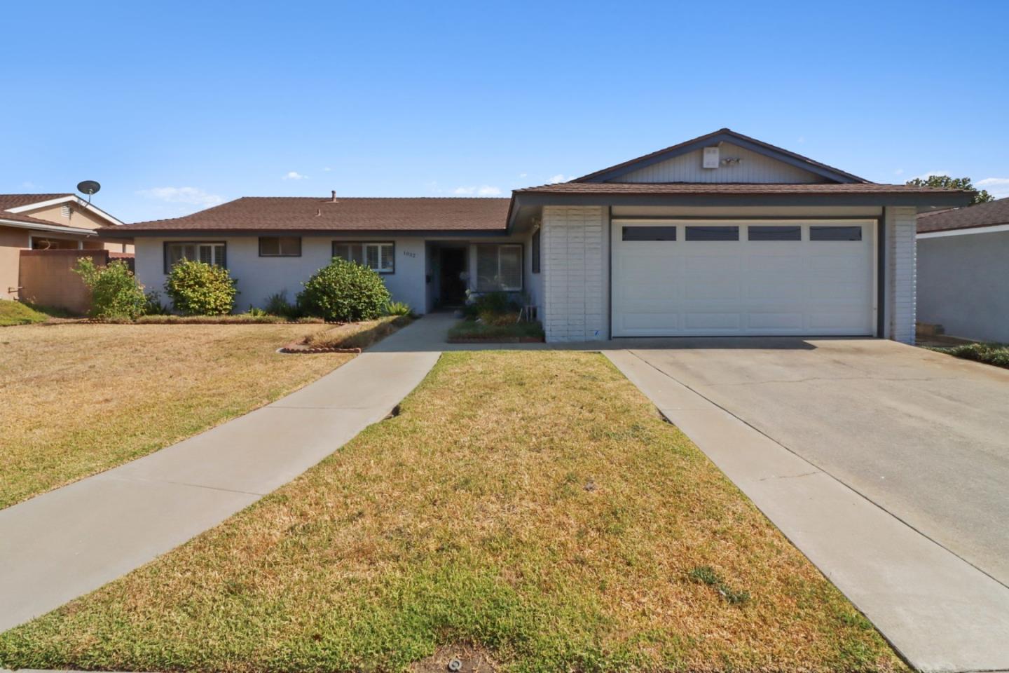 a front view of a house with yard