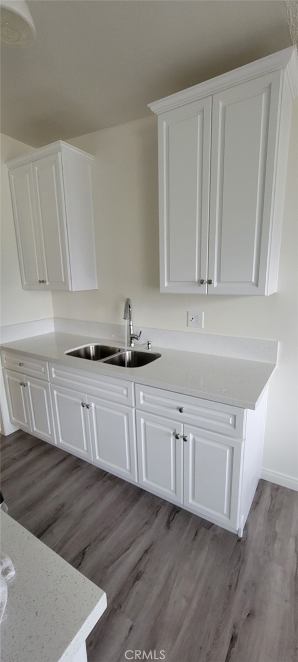 a kitchen with stainless steel appliances granite countertop white cabinets and a granite counter tops