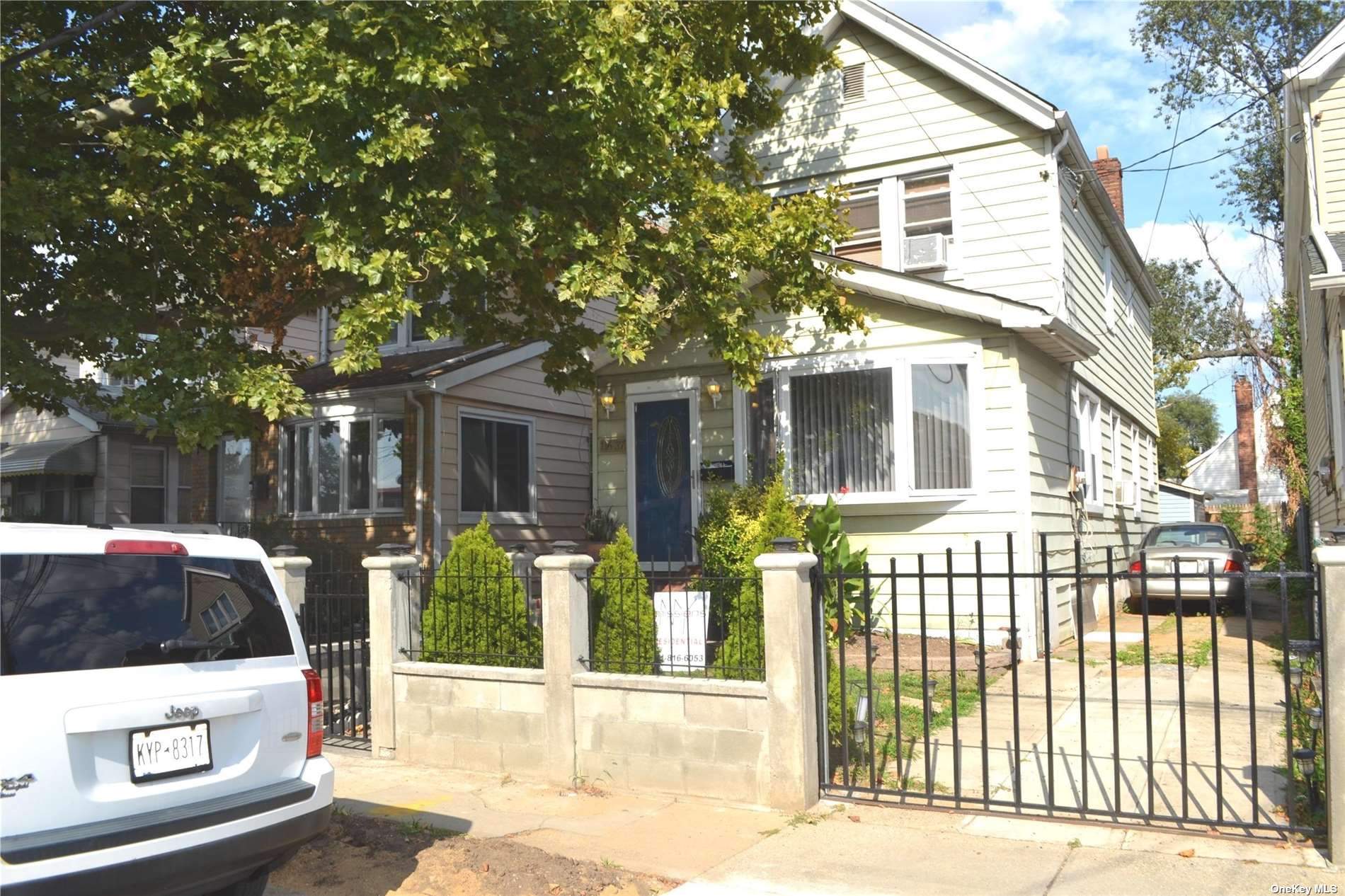 a view of a brick house with a large windows