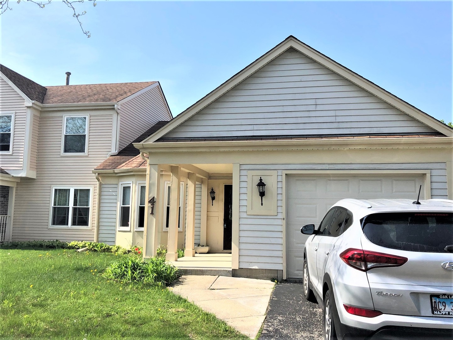 a front view of a house with porch and entertaining space