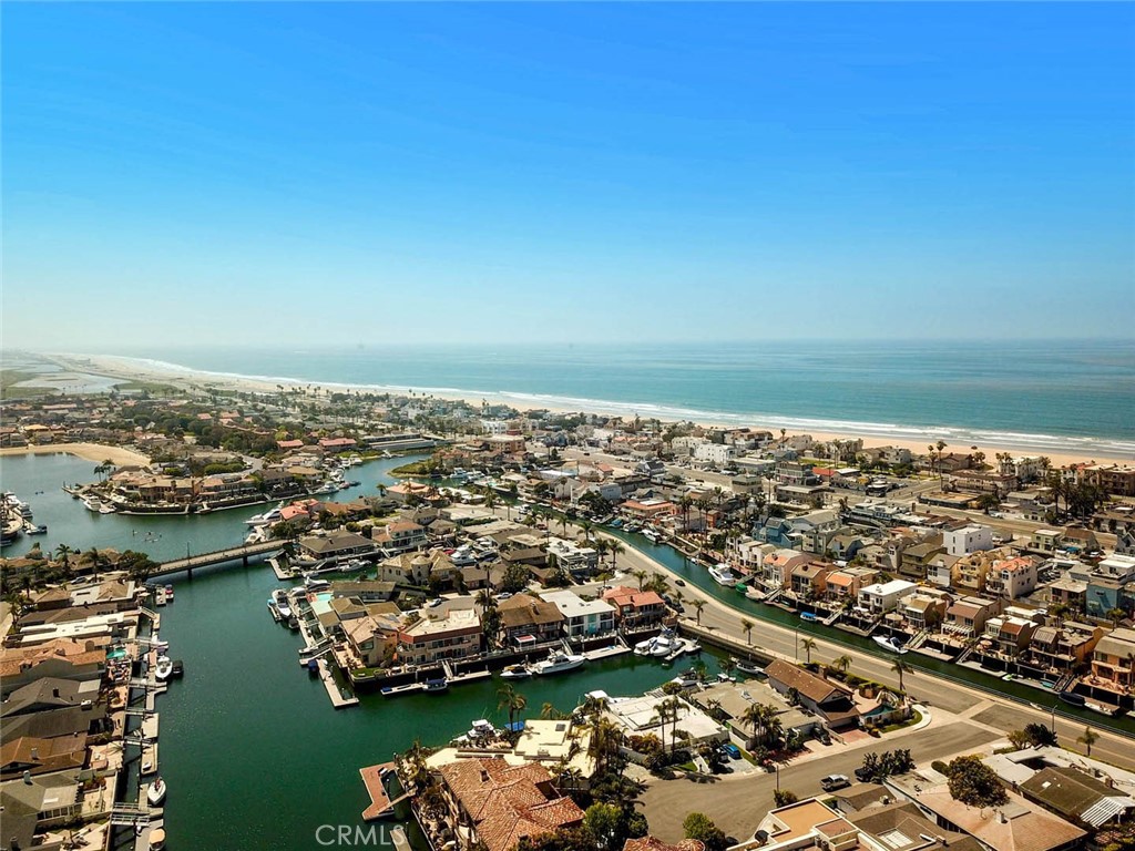 an aerial view of a city with ocean view