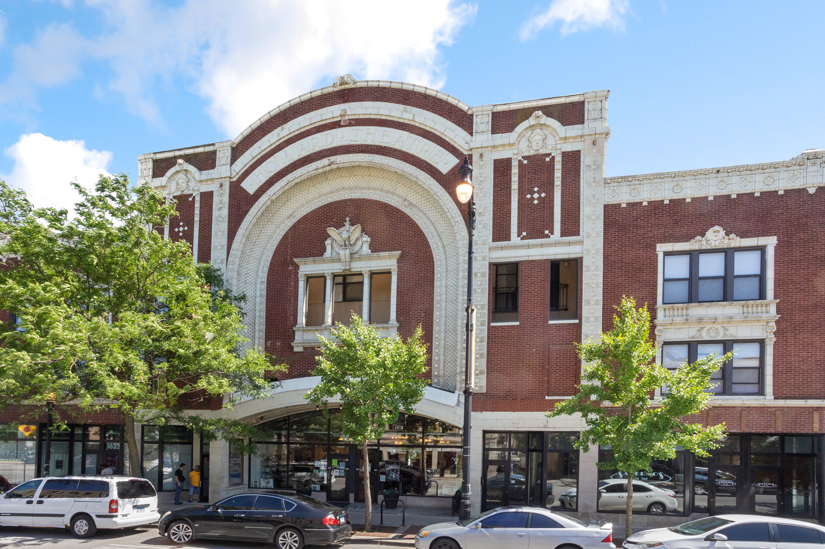 a front view of a building with parking space