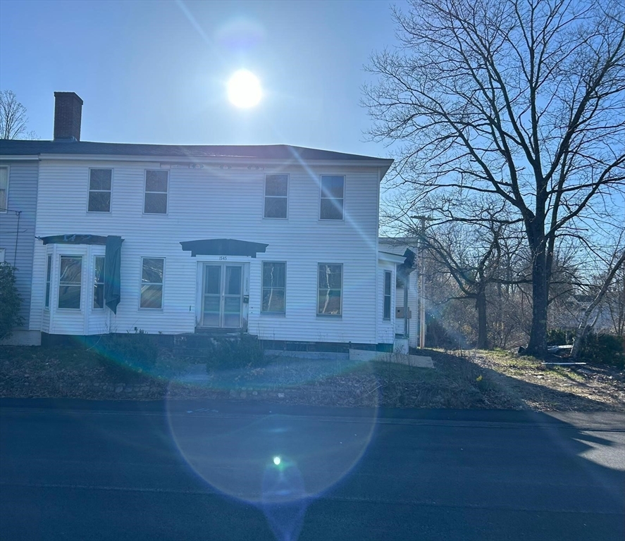 a view of a building with a yard