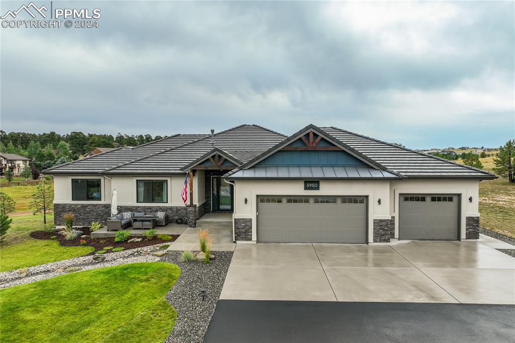 a front view of house with yard outdoor seating and barbeque oven