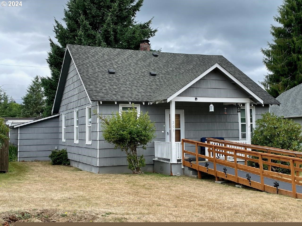 a front view of a house with garden