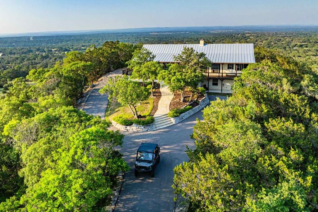 an aerial view of a house with a garden