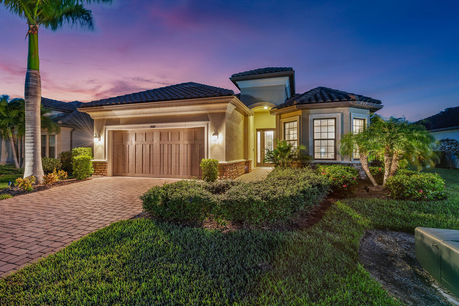 a front view of a house with a yard