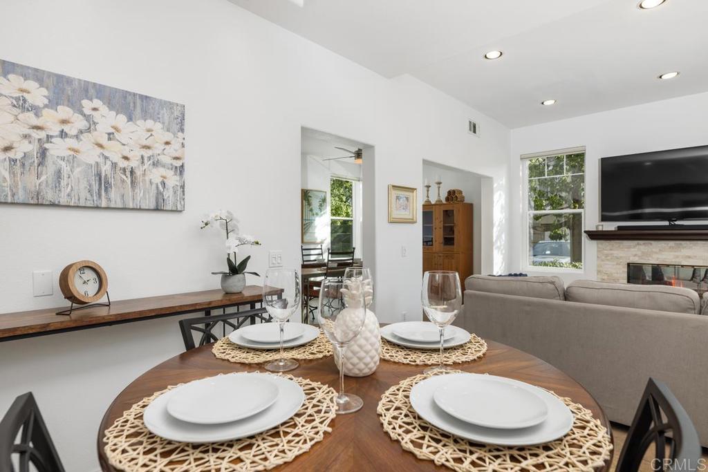 a kitchen with furniture a sink and a dining table