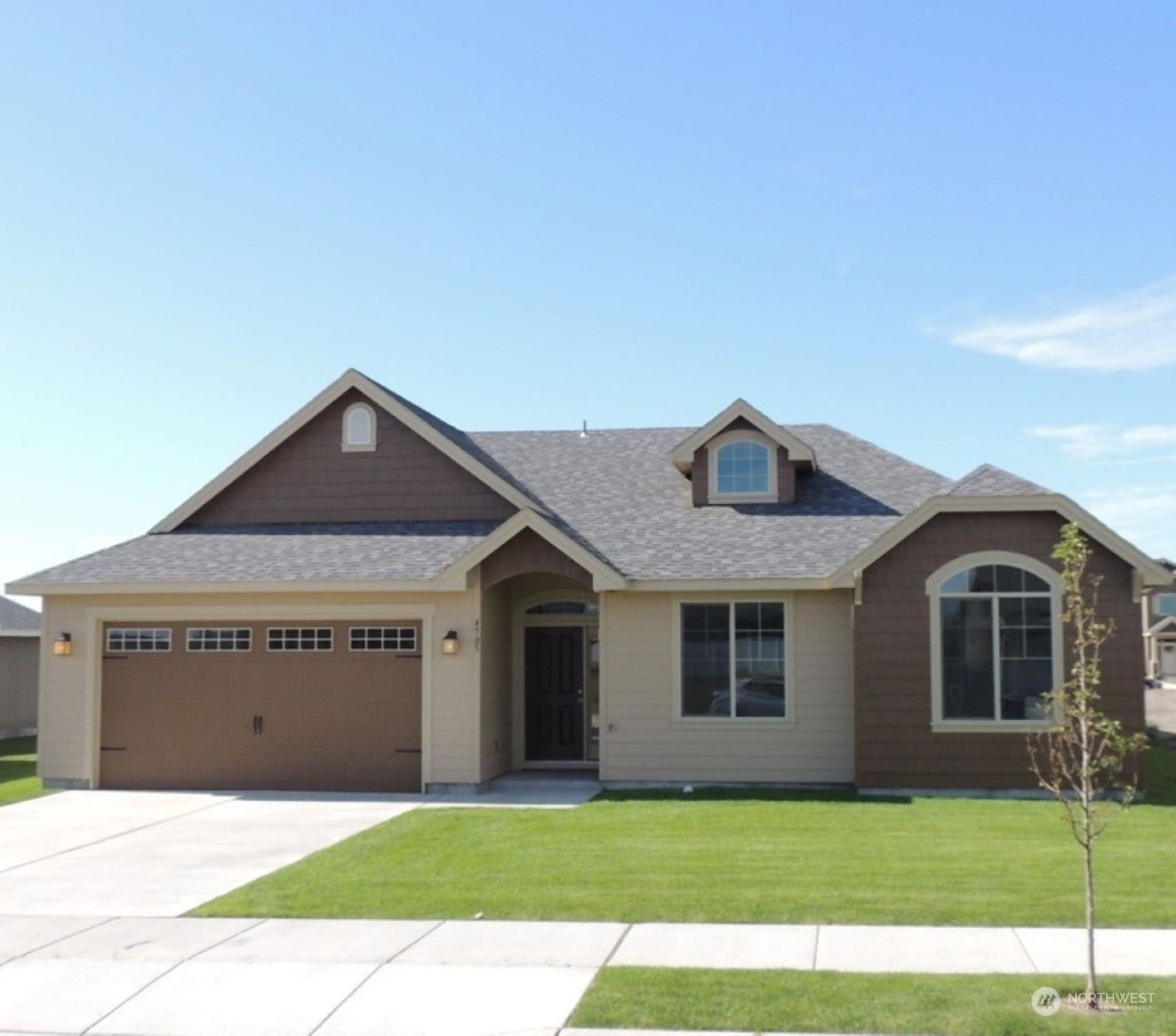 a front view of a house with yard