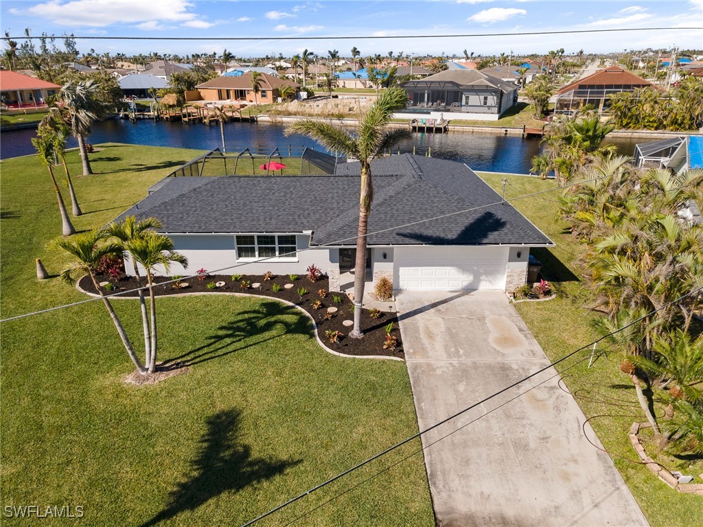 an aerial view of a house with a swimming pool