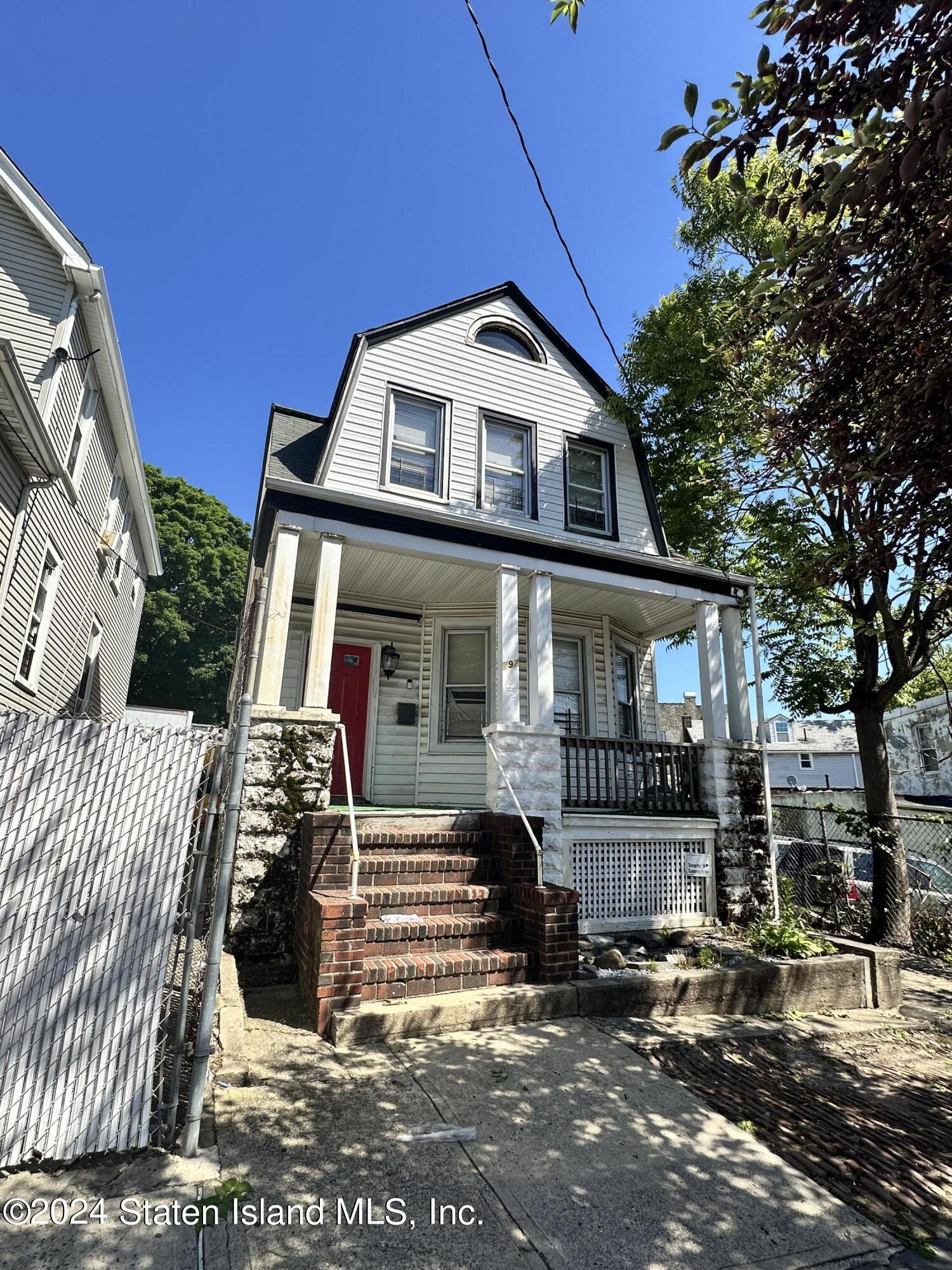 a front view of a house with yard