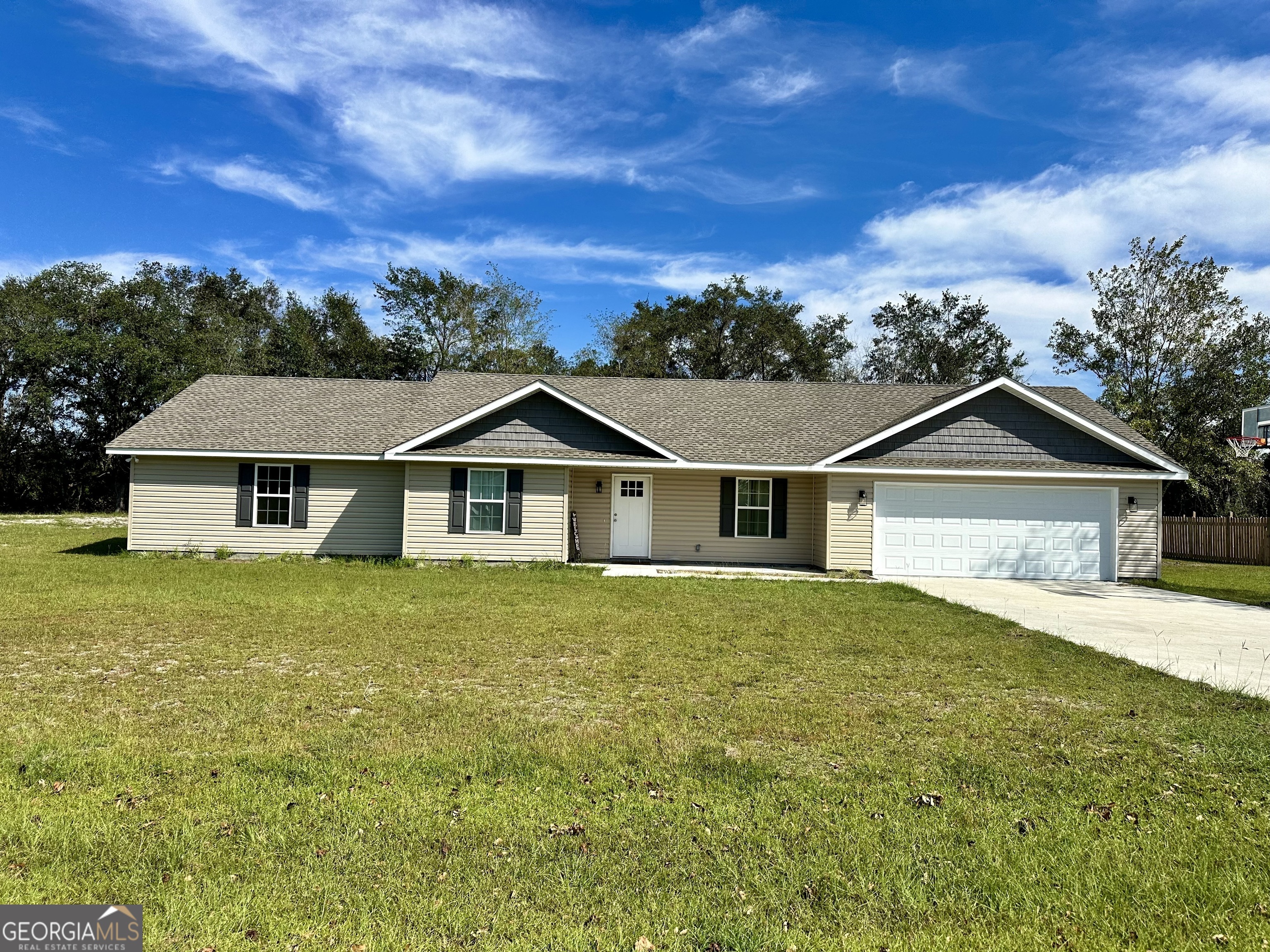 front view of a house with a yard