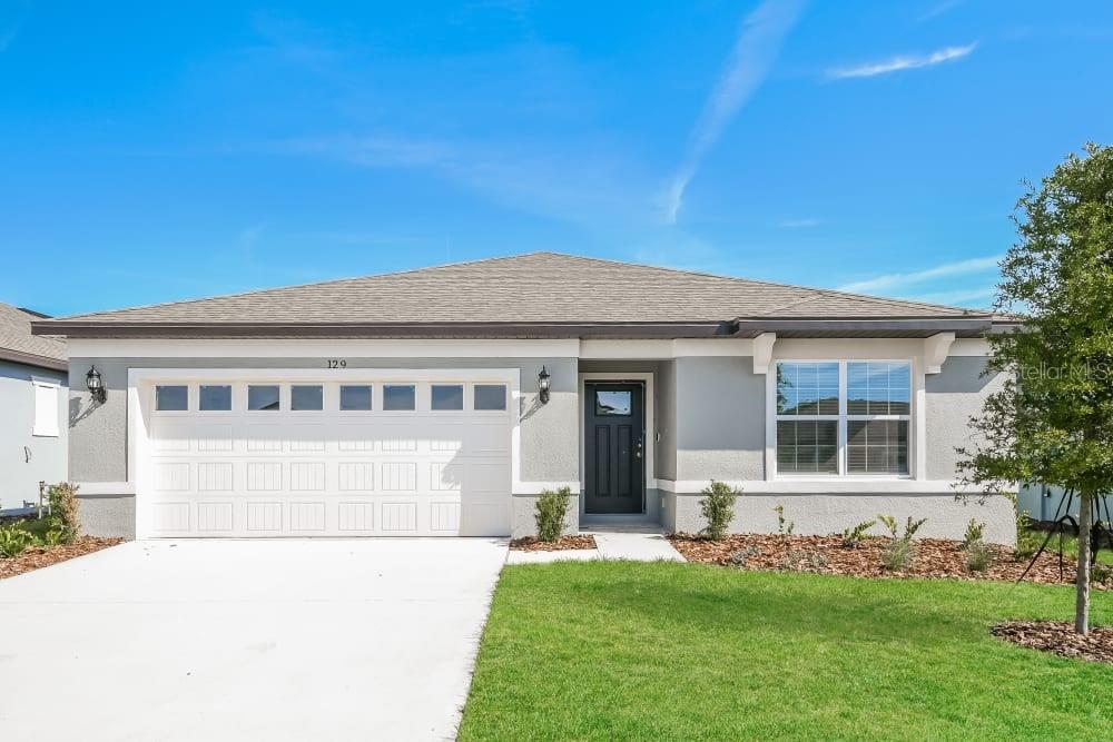 front view of a house with a yard