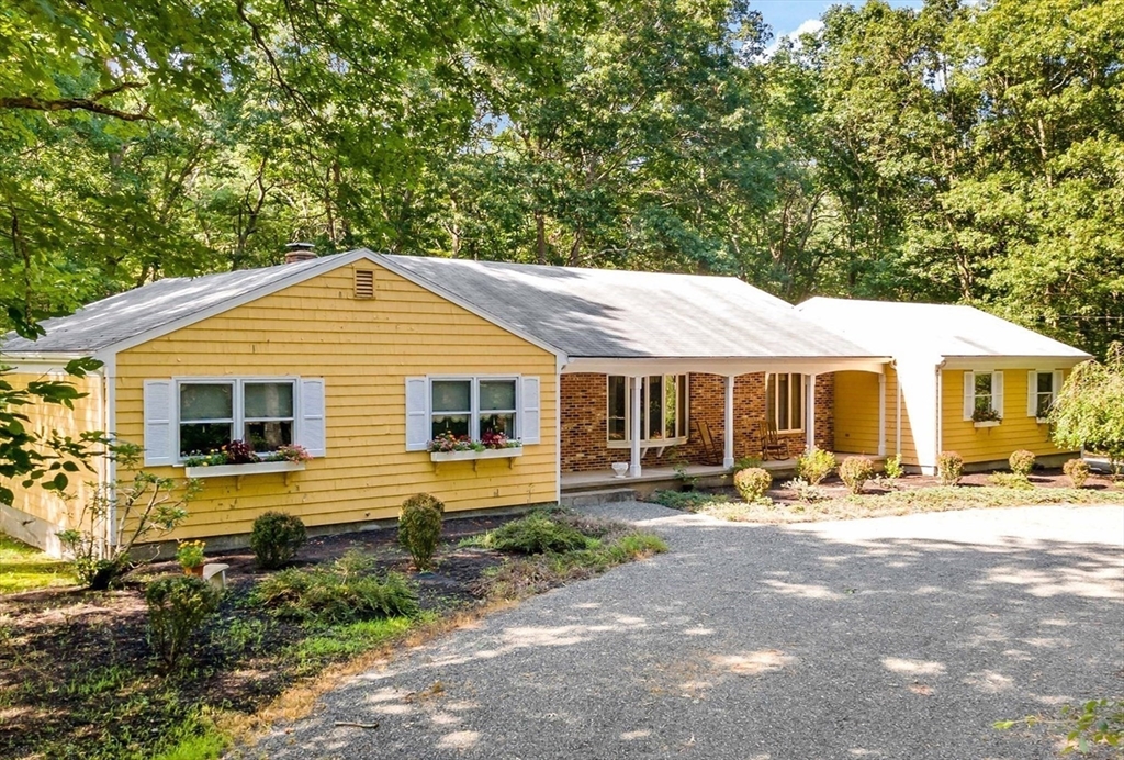 a front view of a house with yard