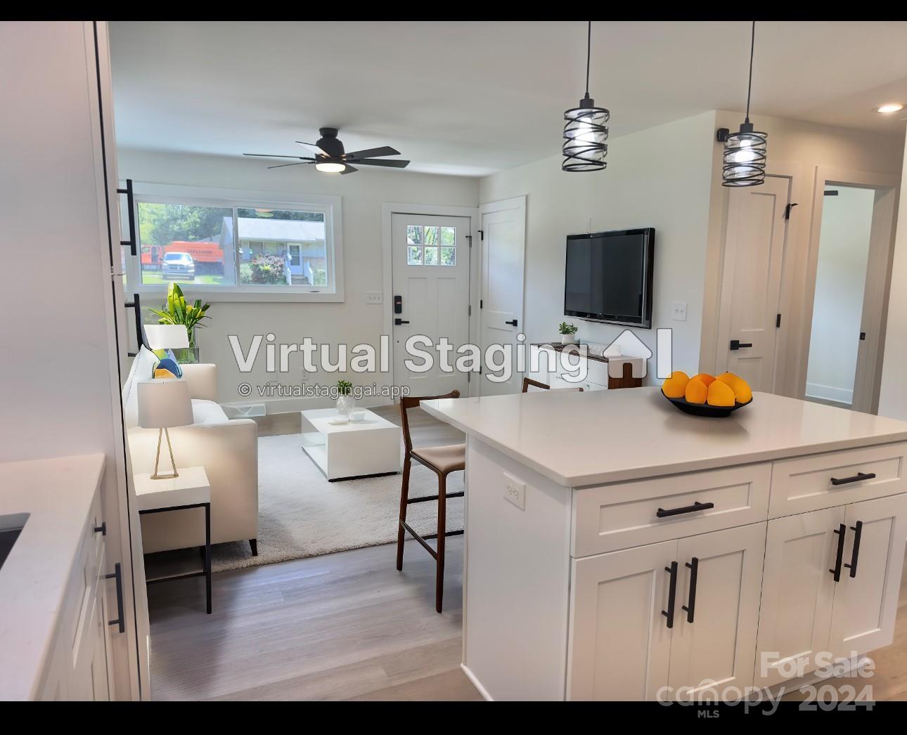 a kitchen with a sink cabinets and wooden floor