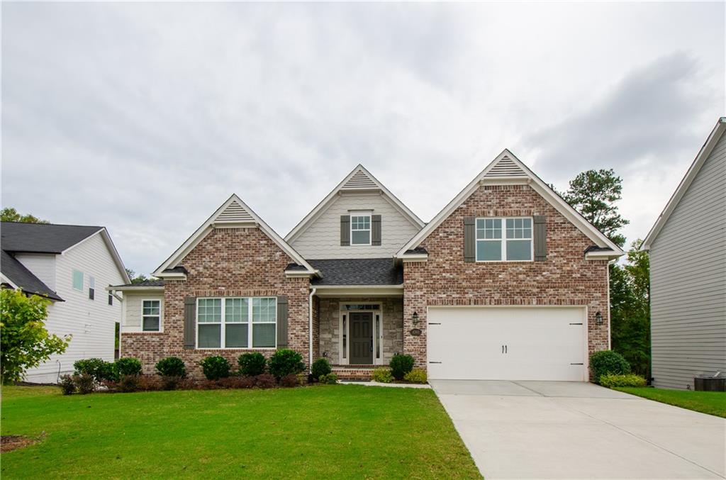 front view of a house with a yard