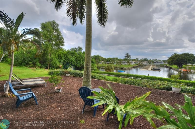 a garden with trees in the background