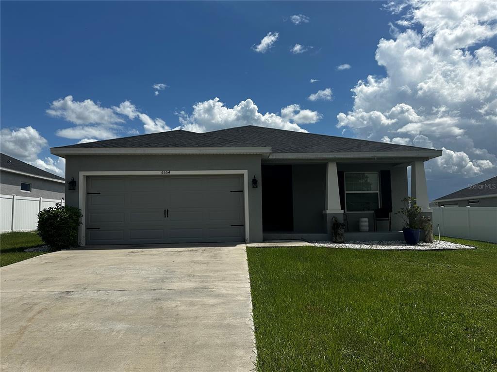 a front view of house with yard and entertaining space