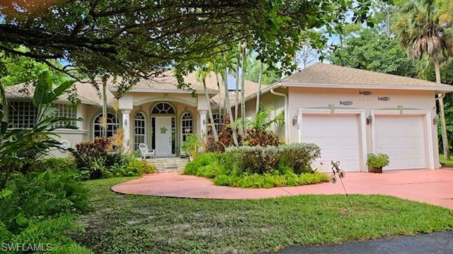 View of front of property featuring a garage