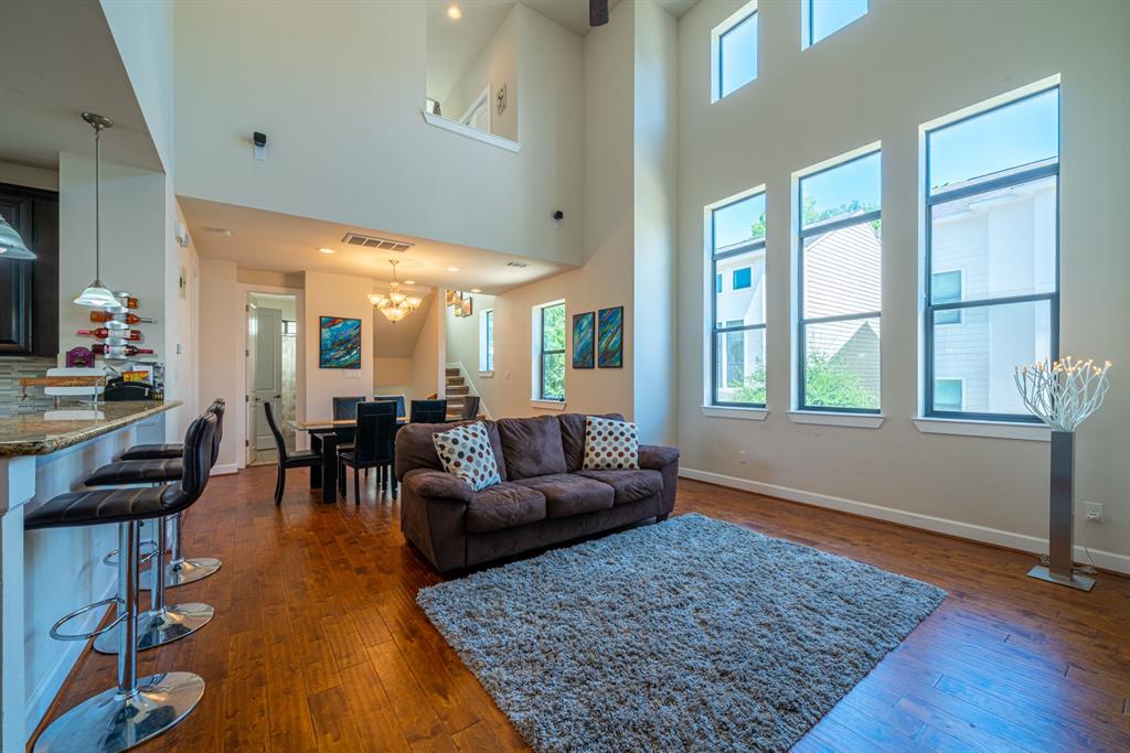 a living room with furniture and a rug