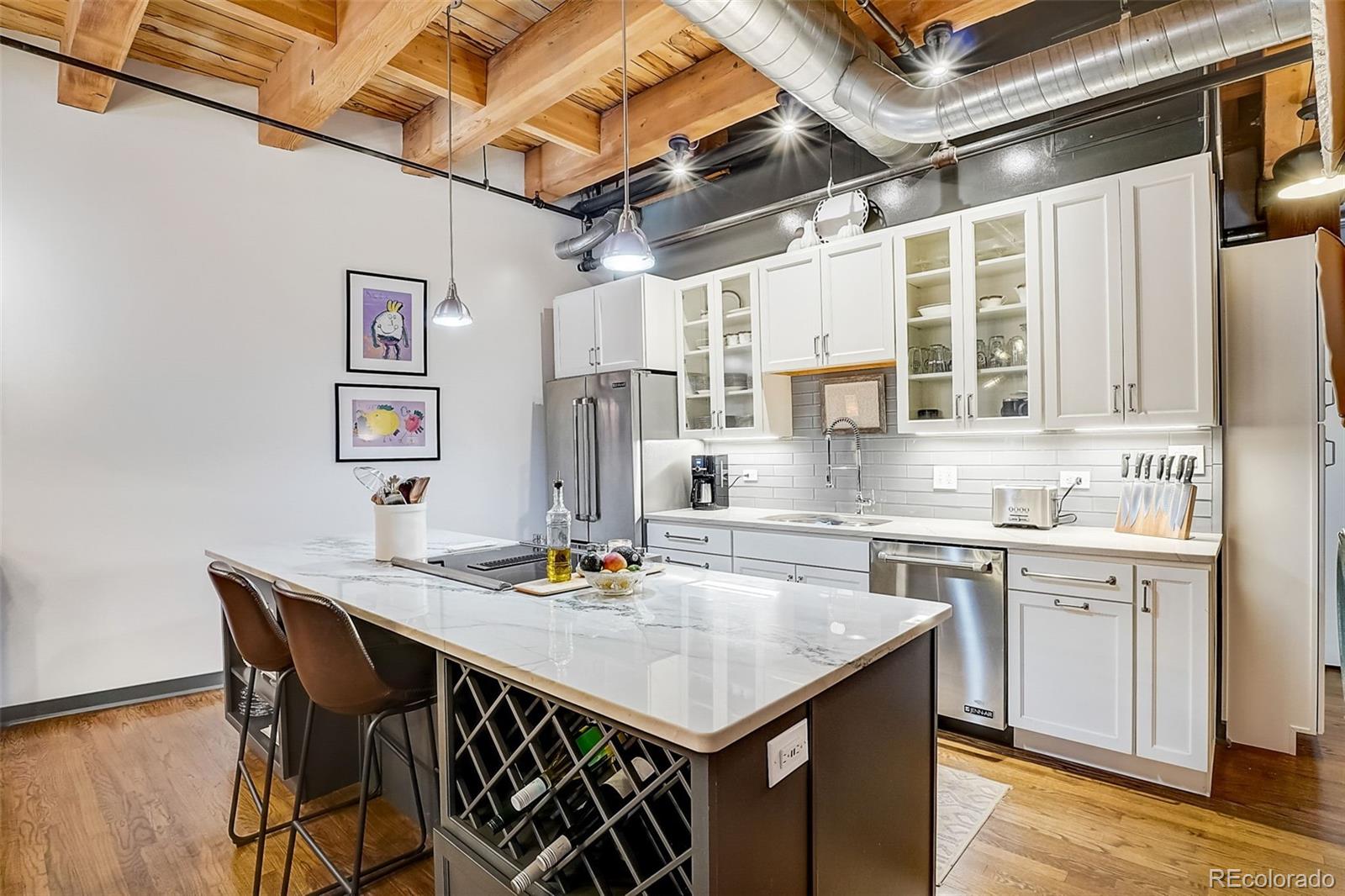 a kitchen with a table chairs stove and cabinets