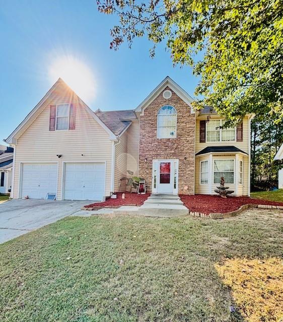 a front view of a house with a yard