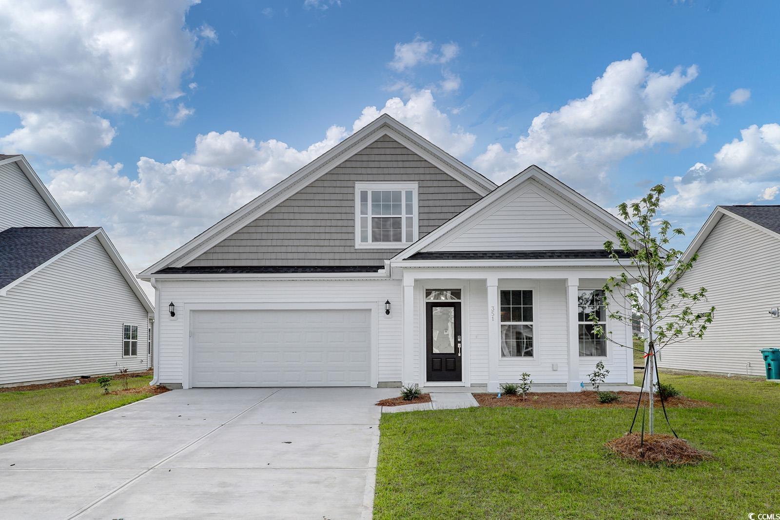 View of front of home featuring a front lawn and a