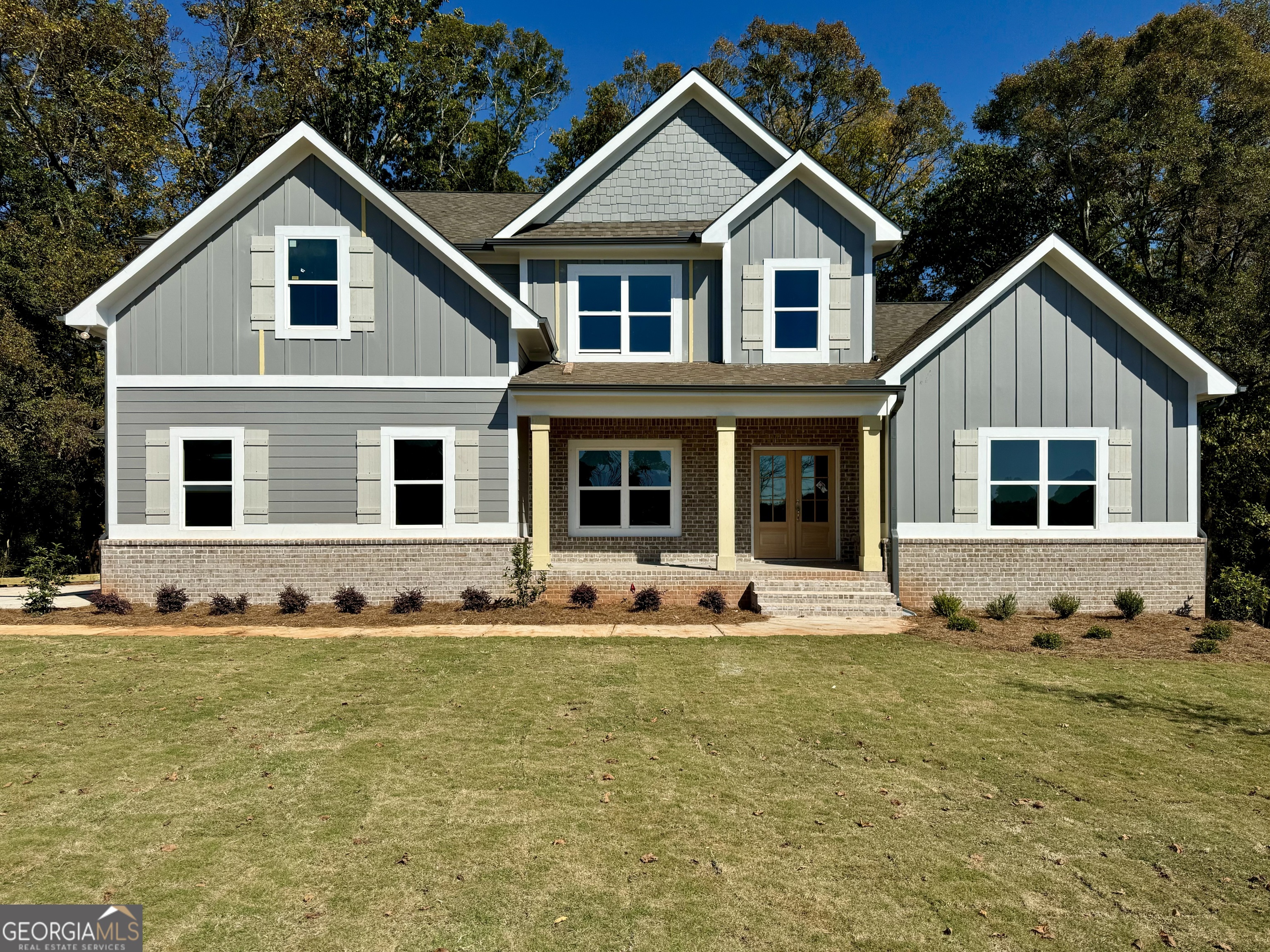 a front view of a house with a yard