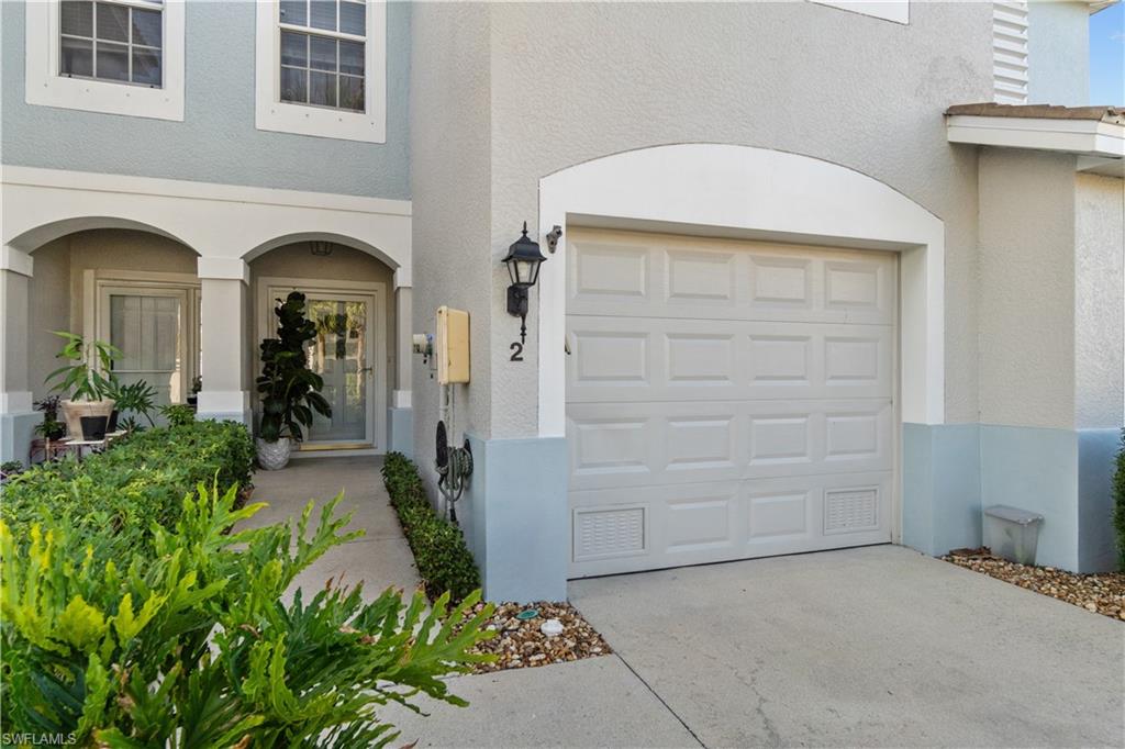 Property entrance with a garage