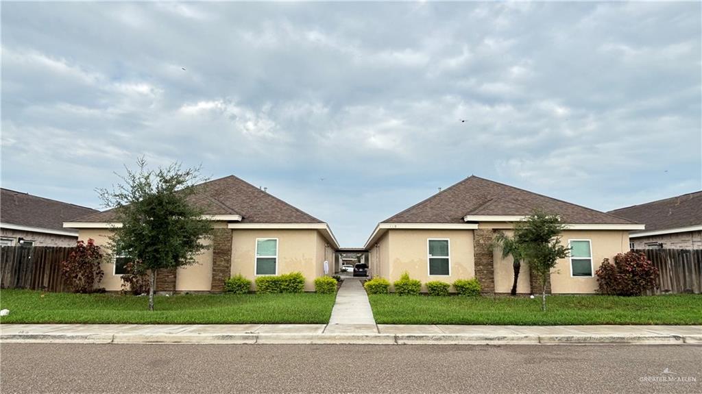 front view of a house and a yard