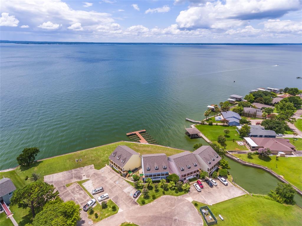 an aerial view of a house with a lake view