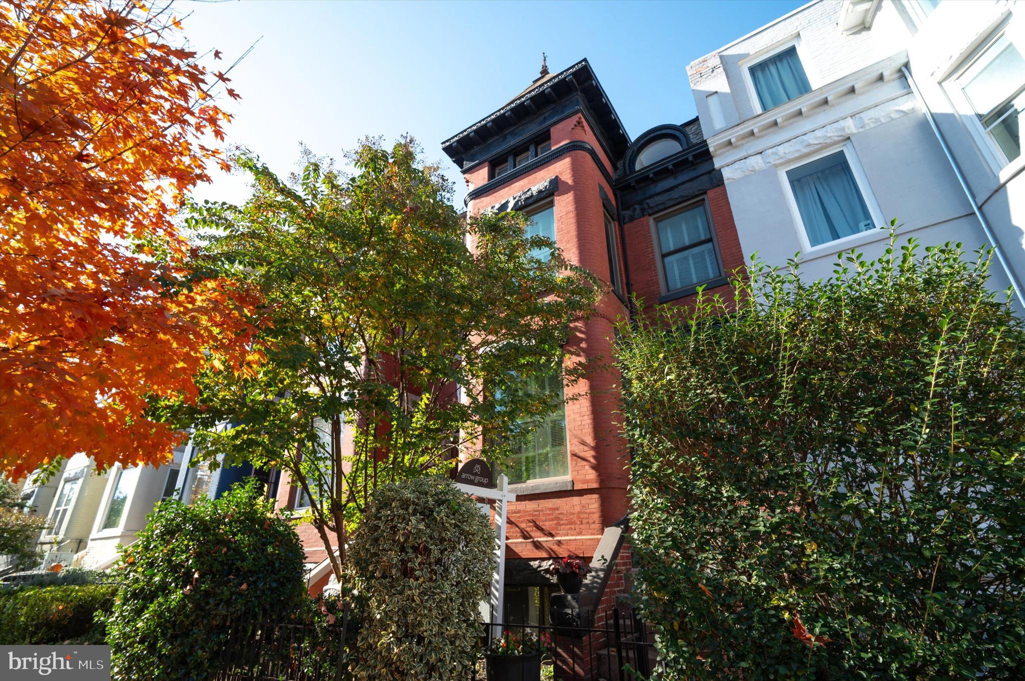 front view of a house with a tree