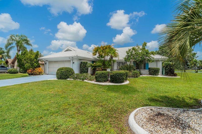 a view of a house with a backyard