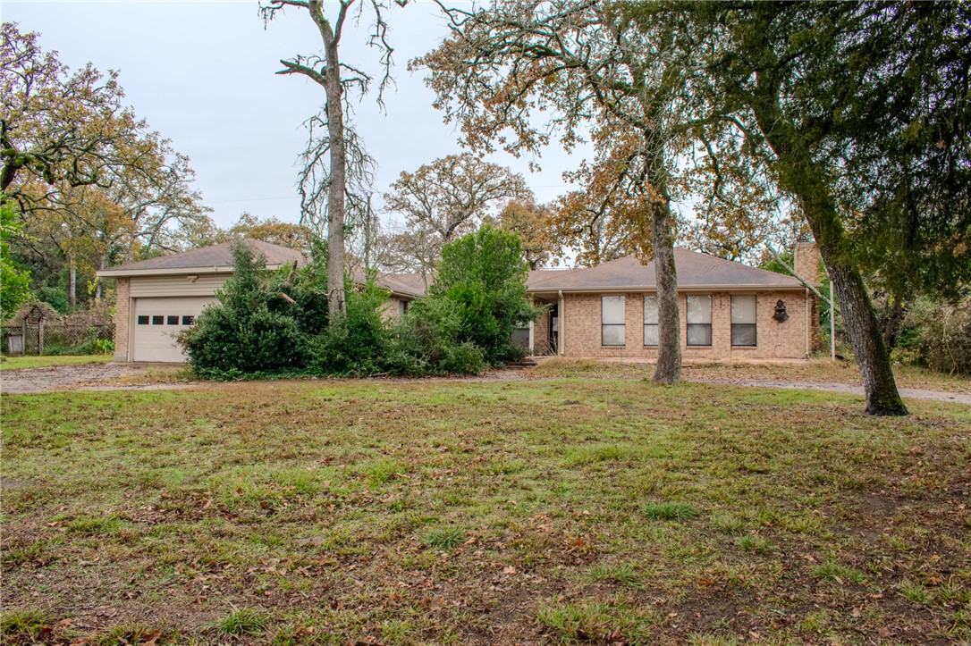 Single story home featuring a front yard