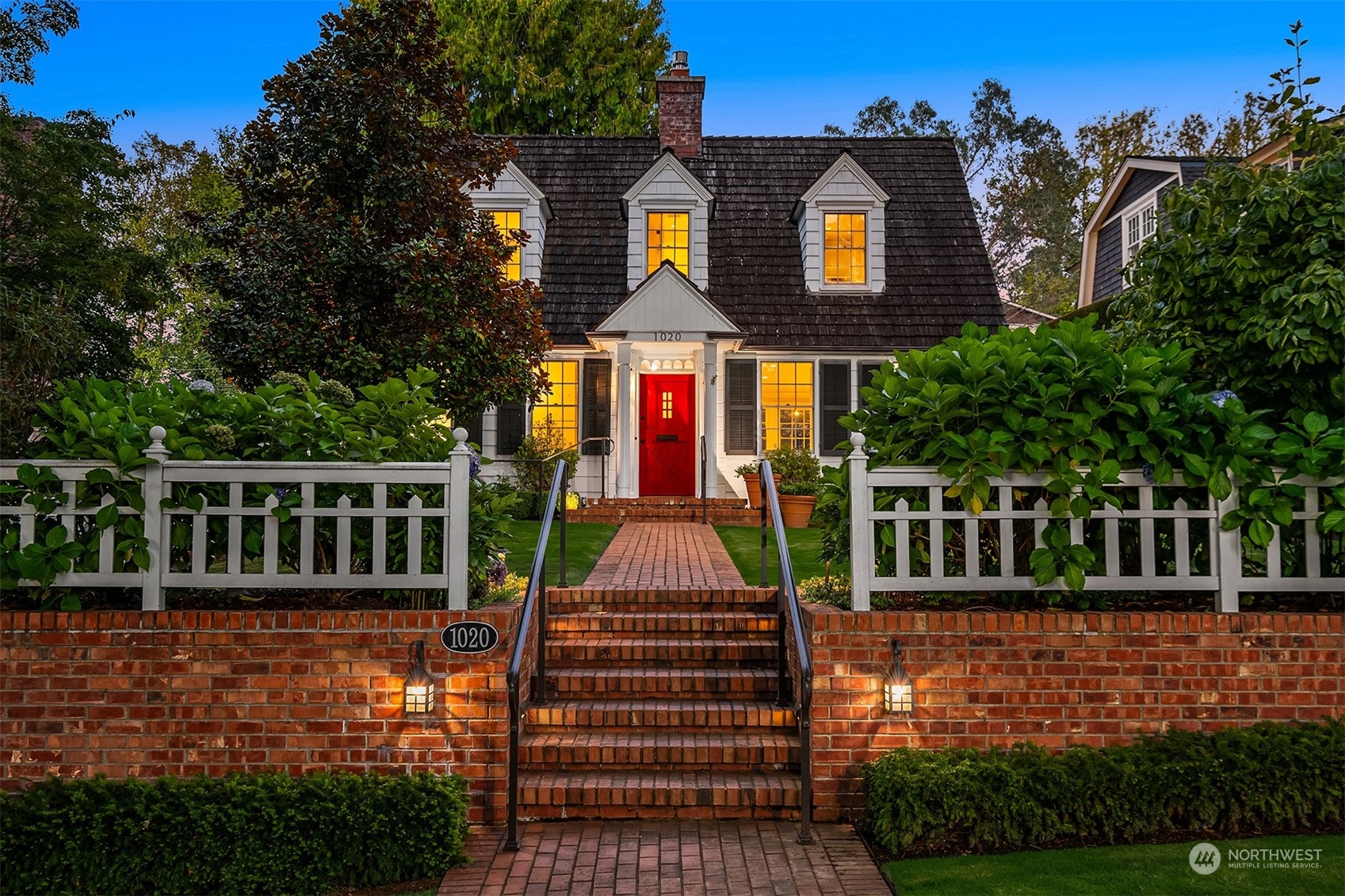 a front view of a house with yard