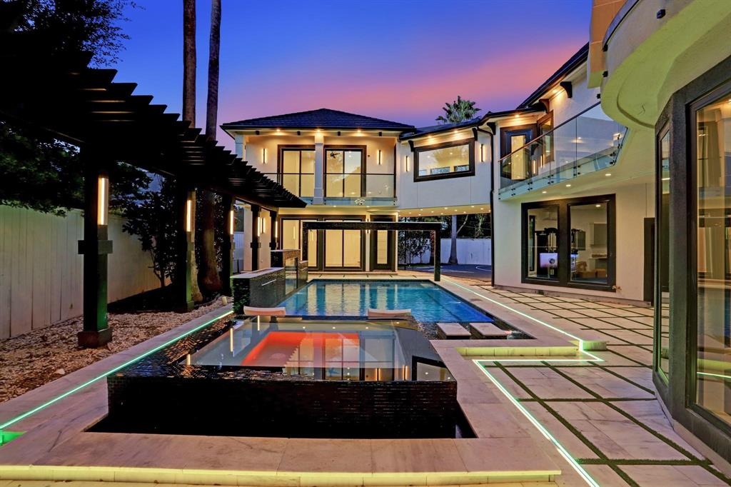 a view of a swimming pool with a lounge chairs