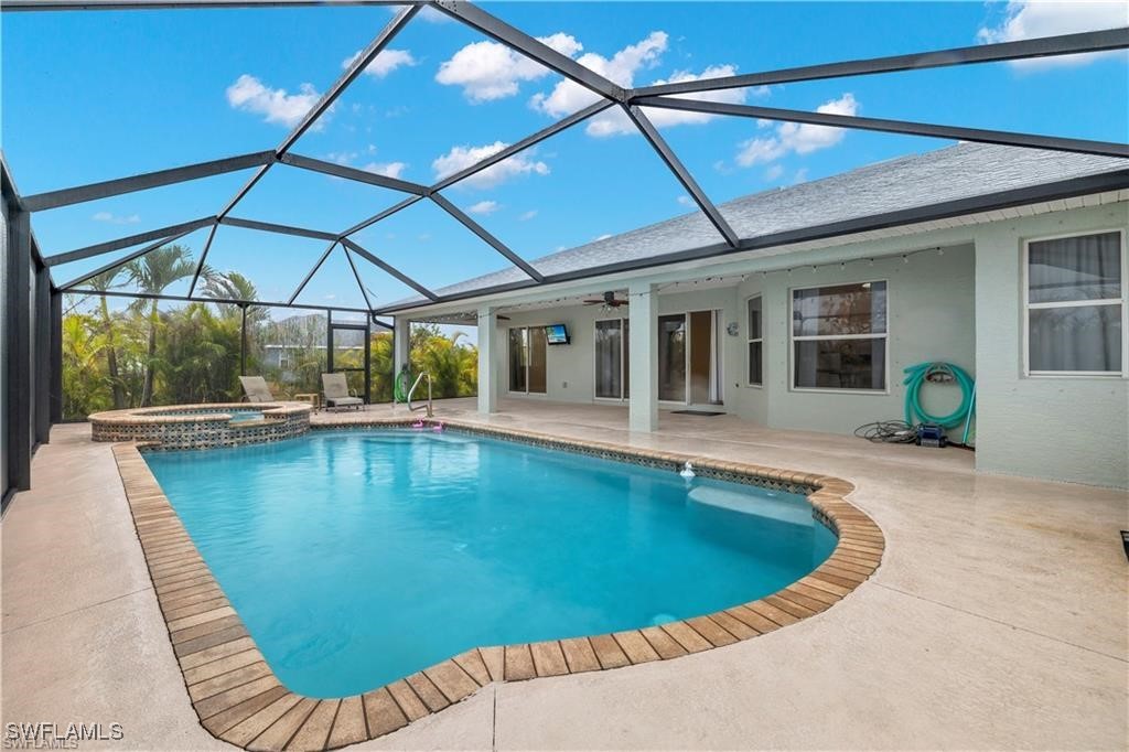 a view of swimming pool with outdoor seating