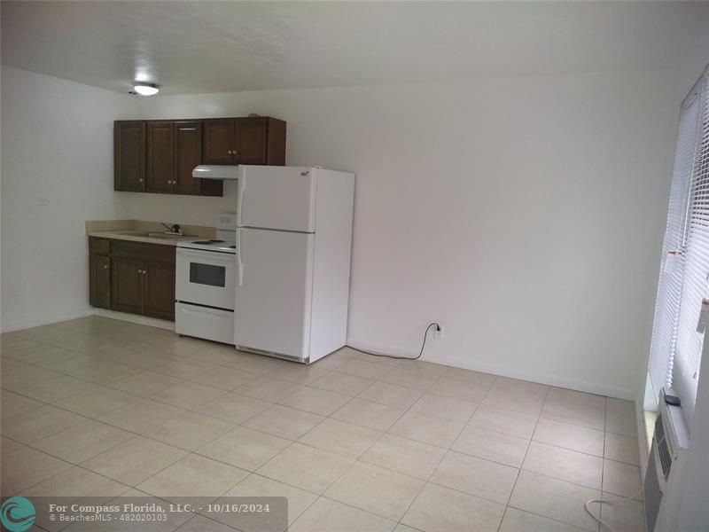 a view of kitchen and microwave