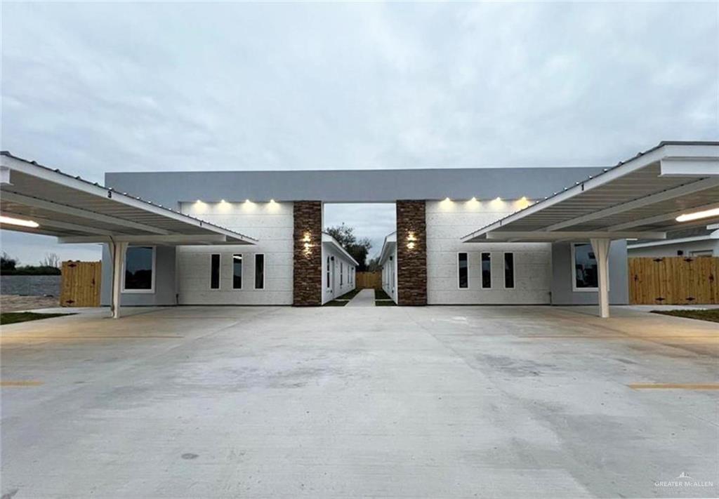 View of front of property with a carport