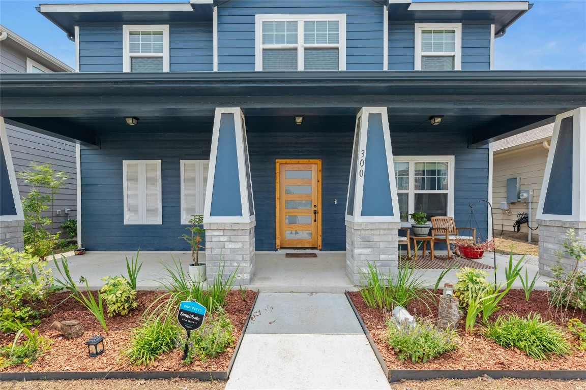 a front view of a house with outdoor seating